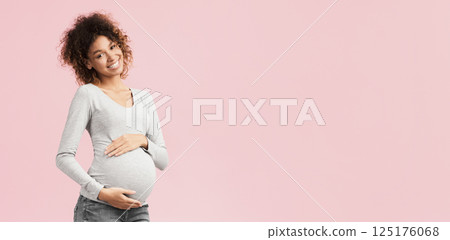 Sweet time of pregnancy. Happy expectant woman hugging her belly over pink studio background Sweet time of pregnancy. Happy expectant woman hugging her belly over pink studio background 125176068
