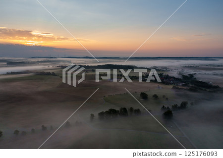 Drone aerial view of a foggy morning in the german village 125176093