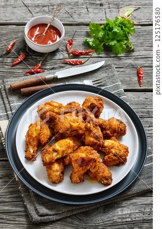 crispy fried chicken wings on a plate crispy fried chicken wings on a plate 125176580