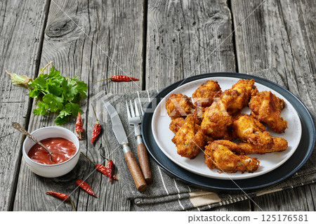 crispy fried chicken wings on a plate crispy fried chicken wings on a plate 125176581