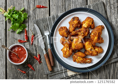 crispy fried chicken wings on a plate crispy fried chicken wings on a plate 125176582