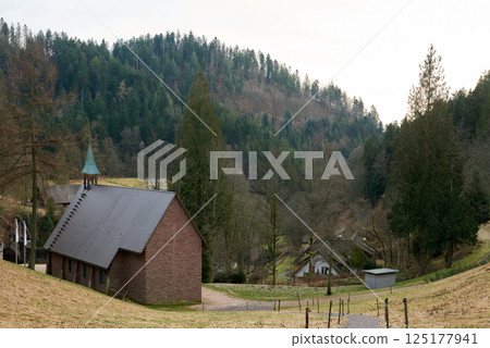 Scenic Countryside Landscape with a Small Brick Chapel and Traditional Houses in a Green Valley of the Black Forest, Germany Scenic Countryside Landscape with a Small Brick Chapel and Traditional Houses in a Green Valley of the Black Forest, Germany 125177941