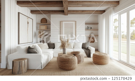 A cozy living space features a sectional sofa adorned with soft cushions, complemented by wooden stools and woven decor 125178429