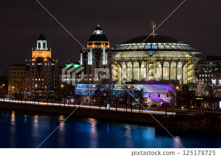 Concert Hall and City Lights Reflected in River at Night 125178725