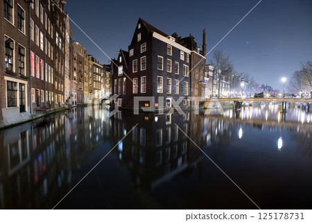 Canal Houses Reflected at Night in Amsterdam 125178731