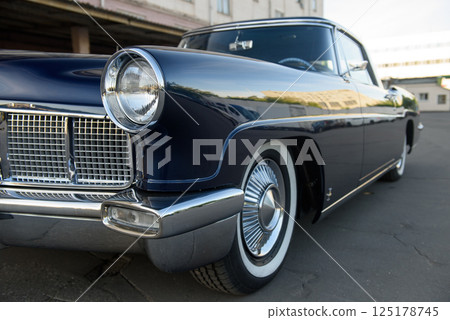 Front Side View of a Dark Blue Vintage Car with Chrome Details Front Side View of a Dark Blue Vintage Car with Chrome Details 125178745