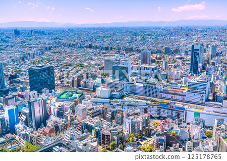 Tokyo cityscape in Japan: Mount Fuji, Ikebukuro Station, the transforming West Exit area (back), and skyscrapers emerge 125178765
