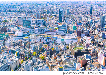 Tokyo cityscape in Japan: Ikebukuro Station and the transforming West Exit area (back), with skyscrapers emerging Tokyo cityscape in Japan: Ikebukuro Station and the transforming West Exit area (back), with skyscrapers emerging 125178767