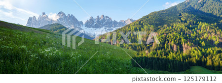 Majestic mountain landscape with snowcapped peaks panorama near Valley of Funes at Dolomites, Italy 125179112