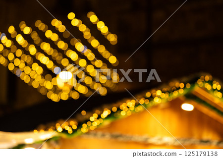 Defocused Christmas Lights and Holiday Stall at Night 125179138