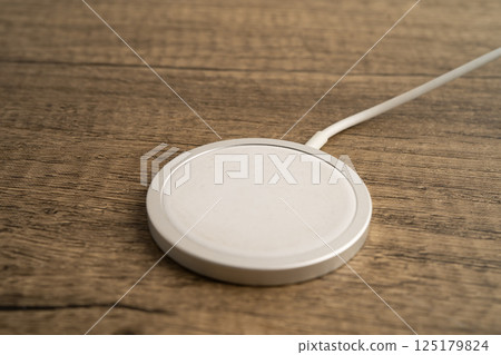 Wireless charger, magnetic charging modern equipment of mobile phone. 125179824