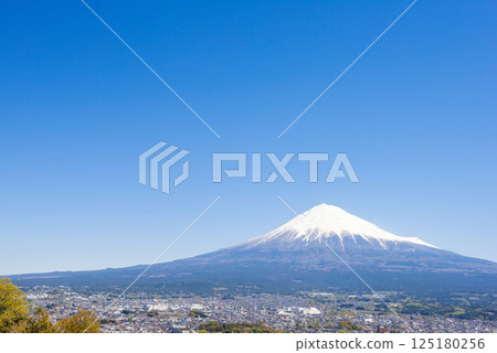 Snow-capped Mount Fuji seen from the summit on a clear day 125180256