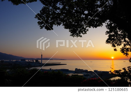 View of the factory and the sunset from Shiroyama Park in Shikokuchuo City, Ehime Prefecture 125180685