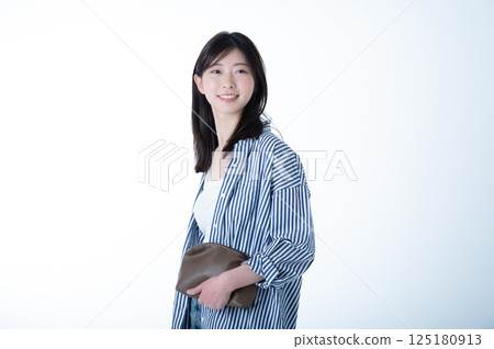 Smiling Japanese female model on white background 125180913