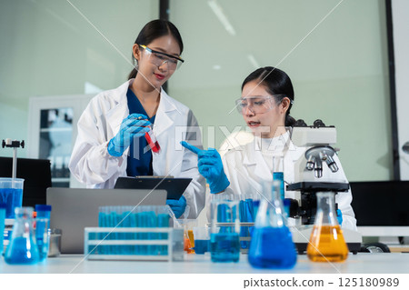 Glass vial, pipette and scientist in laboratory for medical study, research or experiment. Test tube, dropper and professional person with chemical liquid for pharmaceutical innovation. 125180989