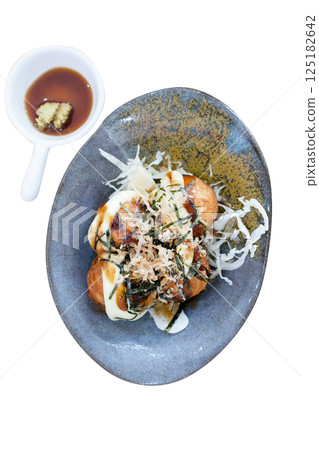 Top view of Takoyaki in a bowl, focus selective Top view of Takoyaki in a bowl, focus selective 125182642