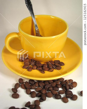 A cup of coffee on a table close view background A cup of coffee on a table close view background 125182915