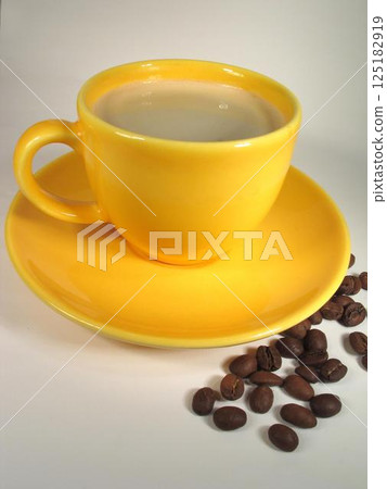 A cup of coffee on a table close view background 125182919