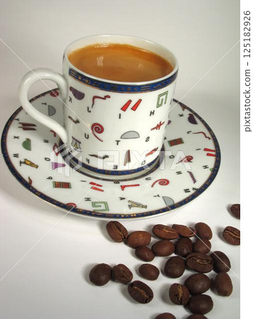 A cup of coffee on a table close view background 125182926