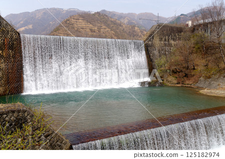 A sabo dam with abundant water A sabo dam with abundant water 125182974