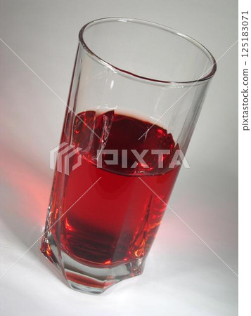 Apple juice in a transparent glass Apple juice in a transparent glass 125183071