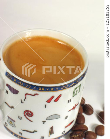 A cup of coffee on a table close view background 125183255