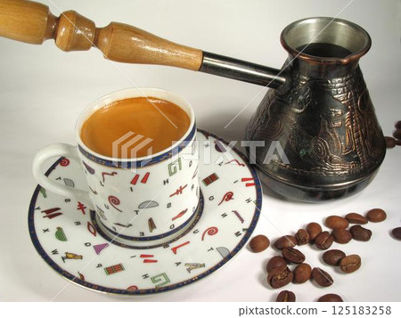 A cup of coffee on a table close view background 125183258