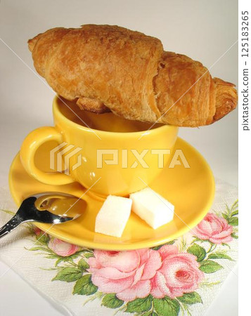 A cup of coffee on a table close view background A cup of coffee on a table close view background 125183265