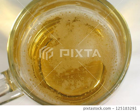 Glass of beer close view background Glass of beer close view background 125183291