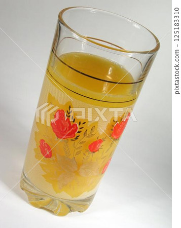 Orange juice in a glass background 125183310