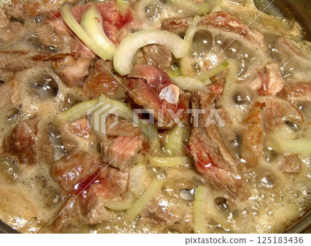 Boiling meat dish close view culinary background Boiling meat dish close view culinary background 125183436