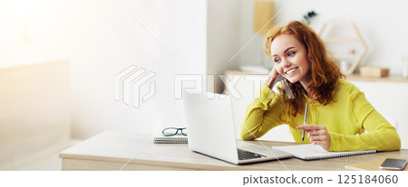 Smiling young female student watching educational lecture online course, writing down notes and summary Smiling young female student watching educational lecture online course, writing down notes and summary 125184060