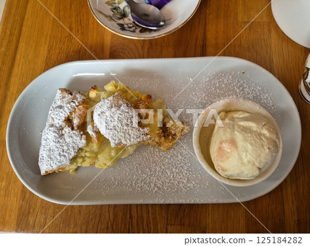 Tasty Cake Dessert On A White Plate Close View Background Tasty Cake Dessert On A White Plate Close View Background 125184282
