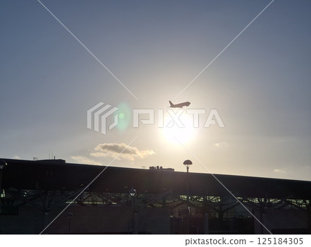 Sunset Sky with Airplane Take Off Background 125184305