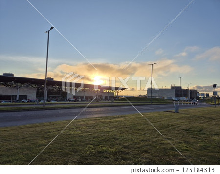 Dusk Skyline with Street Light and Cumulus Clouds Dusk Skyline with Street Light and Cumulus Clouds 125184313