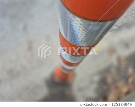 Striped road pole close view background 125184949