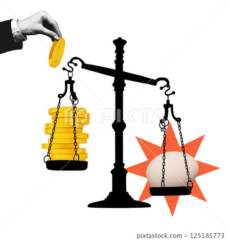 Golden coin outweighs fragile egg on black scale, showing monetary weight crushing essential value 125185773