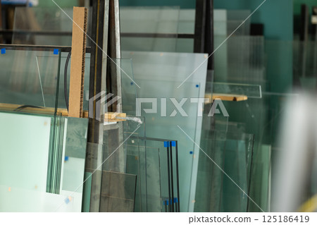 Glass sheets in warehouse at glass factory Glass sheets in warehouse at glass factory 125186419
