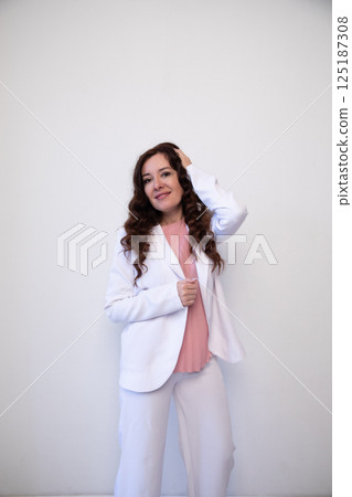 woman smiling on white office background 125187308
