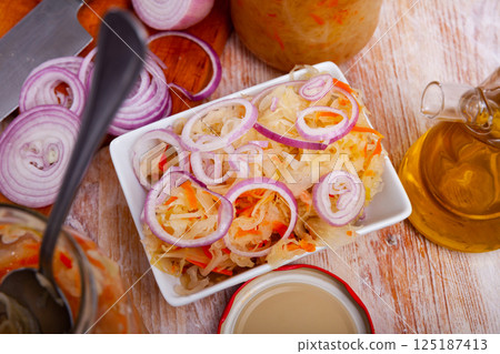 Homemade sauerkraut with onion 125187413