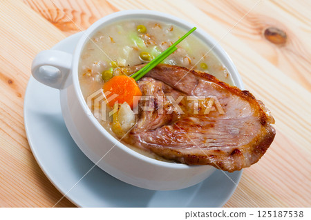 Scottish soup with lamb, root vegetables, pulses and barley 125187538