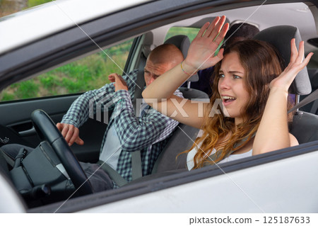 Driver and passengers scared screaming in the car before the accident Driver and passengers scared screaming in the car before the accident 125187633