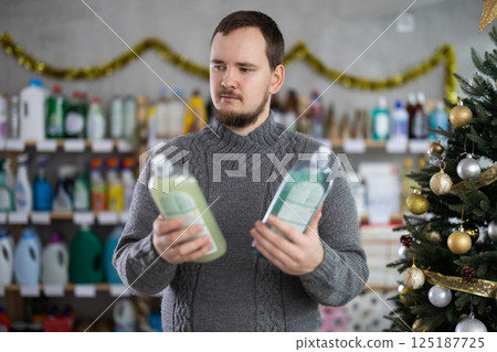 On New Year Eve, man choose and buy dishwashing soap On New Year Eve, man choose and buy dishwashing soap 125187725