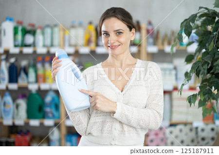 Young woman choosing laundry detergent in department store Young woman choosing laundry detergent in department store 125187911