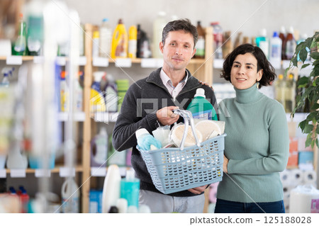 Married couple with basket in supermarket 125188028
