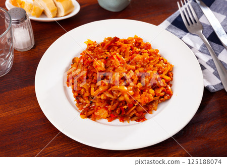 Vegetarian dish - barley with stewed cabbage closeup Vegetarian dish - barley with stewed cabbage closeup 125188074