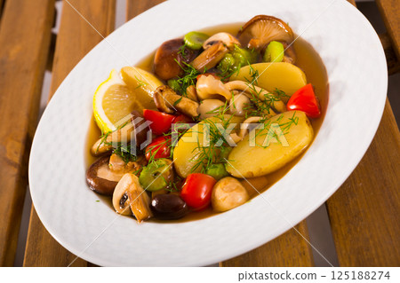 Rustic soup with wild mushrooms 125188274