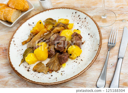 Braised veal with potato and forest mushrooms Braised veal with potato and forest mushrooms 125188304
