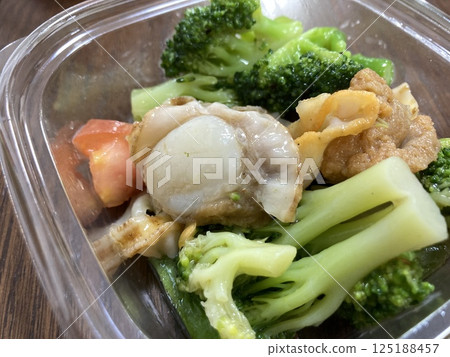 A salad with lots of ingredients bought at the supermarket 125188457