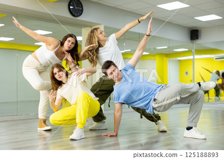 Group portrait of lucky teenagers in dance studio 125188893